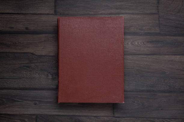 istock Book, top view on wooden 909096588