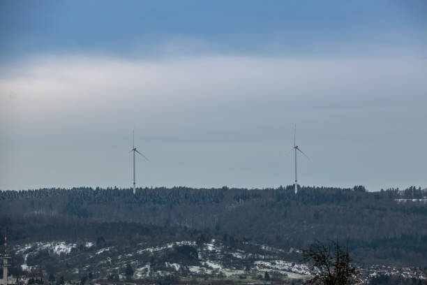 istock Wind power near the village 909097094