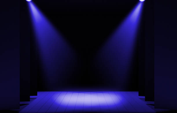istock Stage lights ,free stage,concerrt stage .Several projectors on the ceiling. Spotlight strike through the darkness to the floor. 909101322