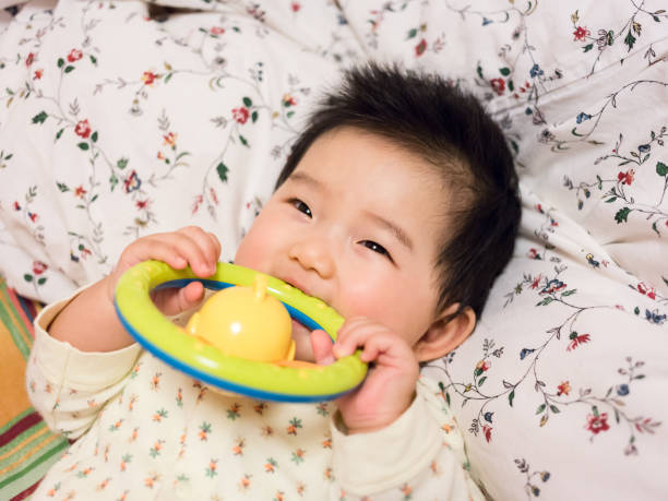 Cute baby smiling close-up Holding a toy