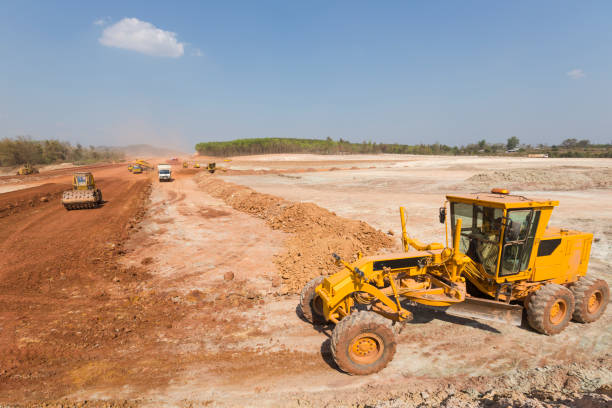 Road Construction Road under construction at Mae Sot, Tak, Thailand bagger stock pictures, royalty-free photos & images