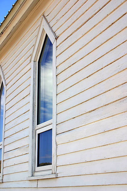 church window with cloud reflection stock photo