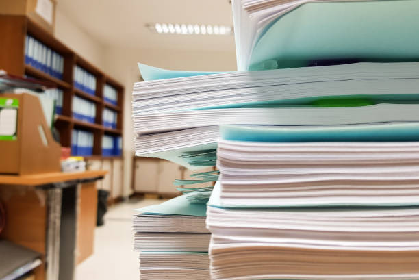 istock Stacks of paper document on Beautiful office background,design for Illustration website and magazine. 909114134