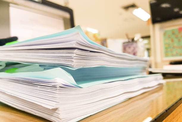istock Blue paper document with office equipment on desk,office concept background,design for advertising. 909114200