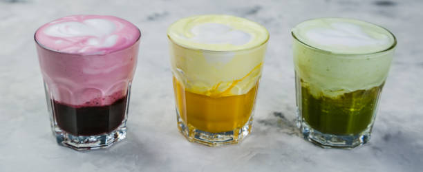 istock Selection of colorful super lattes on marble background 909115228