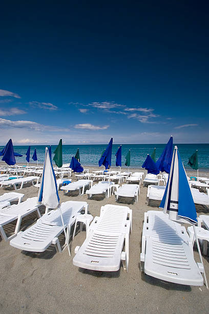 istock Summer seaview with deck-chairs and umbrellas 90911718