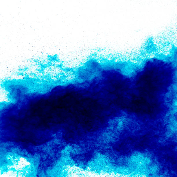 istock abstract blue dust explosion on  white background. abstract blue powder splattered on white  background. Freeze motion of blue powder exploding 909119076