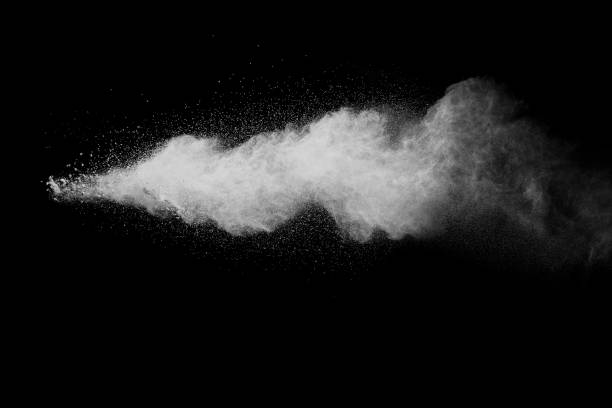 istock Launched white particle splash on black background. Bizarre forms of of white powder explosion cloud against dark background. 909119308