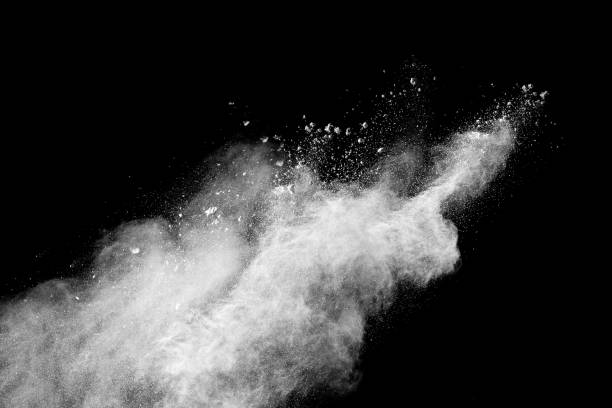 istock Launched white particle splash on black background. Bizarre forms of of white powder explosion cloud against dark background. 909119310