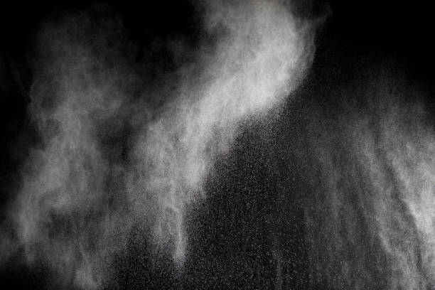 istock Launched white particle splash on black background. Bizarre forms of of white powder explosion cloud against dark background. 909119336