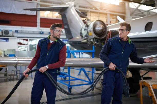istock Aircraft mechanics in the hangar 909119490