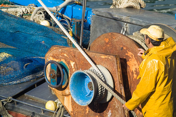 istock fisherperson on the ship 90912334