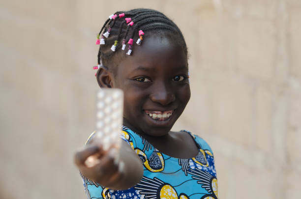 Portrait Shot of African Black Girl With Medicine stock photo