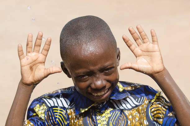 istock Handsome Young Boy Showing Hands Laughing Outdoors 909126430