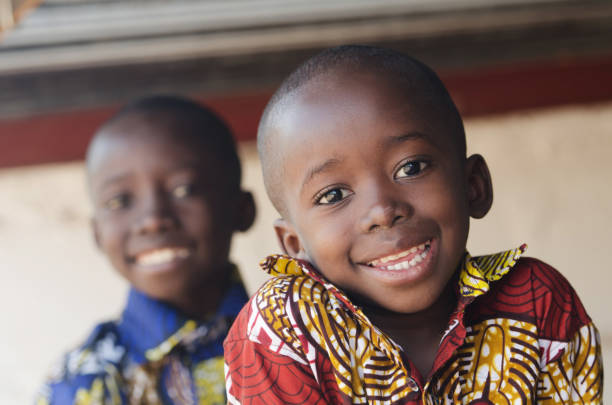istock Two Gorgeous African Children Portrait Outdoors Smiling and Laughing 909126480