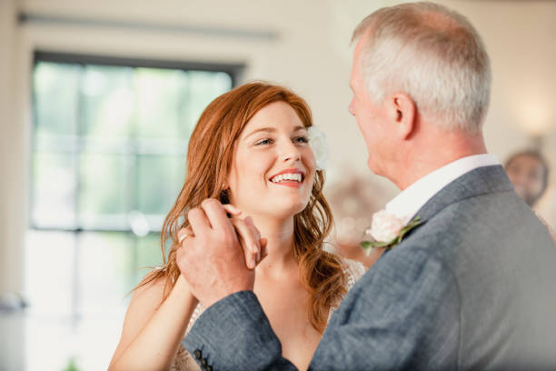 Dancing with my Father at my Wedding Beautiful bride is enjoying a dance with her father on her wedding day. dancing dad stock pictures, royalty-free photos & images