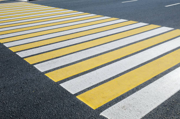 istock Crosswalk  pedestrian crossing through a street 909126932