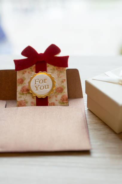 istock Valentine day background,hearts border on wood with a gift, copy space 909129168
