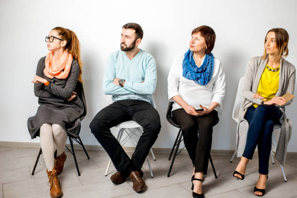 istock People in casual sitting in a row 909133124