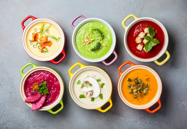 soup Variety of colorful vegetables cream soups in small pots. Top view. Concept of healthy eating or vegetarian food. soup stock pictures, royalty-free photos & images