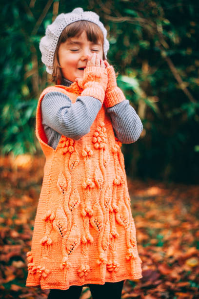 istock Girl is laughing, playing in the forest 909138978