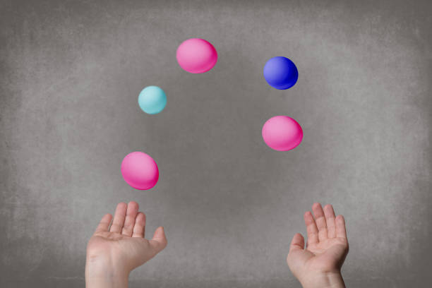 istock Female hands juggle colorful eggs. 909141812