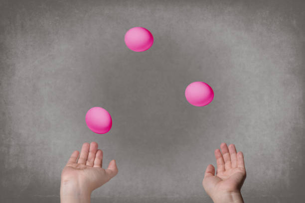 istock Female hands juggle colorful eggs. 909141816