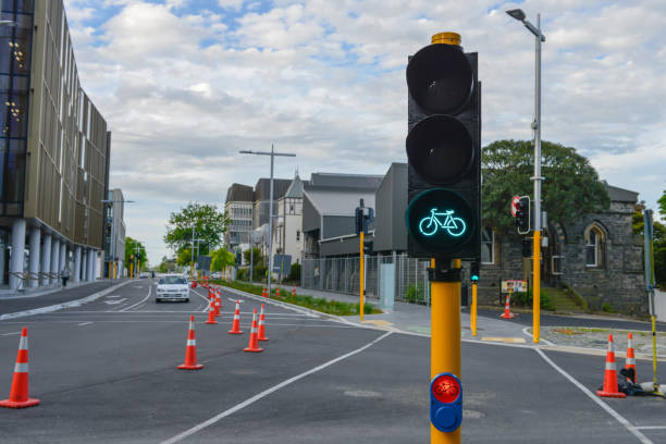 green led sign for bicycle to crossing the road - single lane road imagens e fotografias de stock