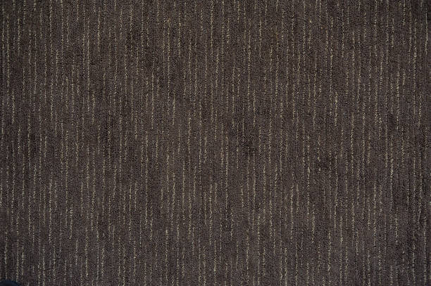 istock Surface of floor covering brown carpet 909149062