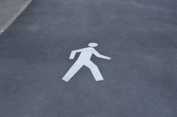 Walk way sign on the road surface