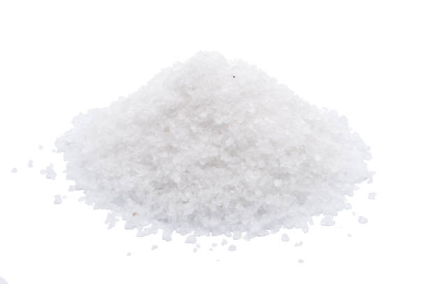 istock White sea salt isolated on white background 909153232