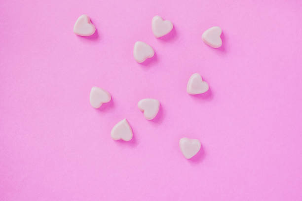 istock valentine candy hearts shape on pink background 909158232