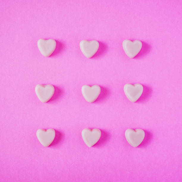 istock valentine candy hearts shape on pink background 909158234