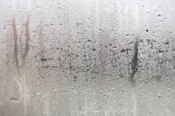Condensation Condensation on window glass caused by high humidity in winter. humidity photos stock pictures, royalty-free photos & images