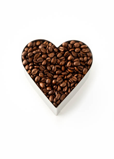 Coffee beans in a Heart Shape Cookie Cutter Isolated on a white background
