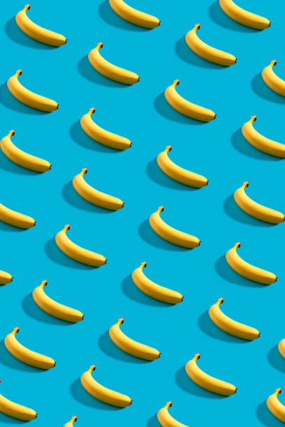 istock Colorful pattern of bananas on sky blue background 909163708