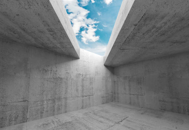 istock Concrete walls and blue sky in ceiling opening 909164188