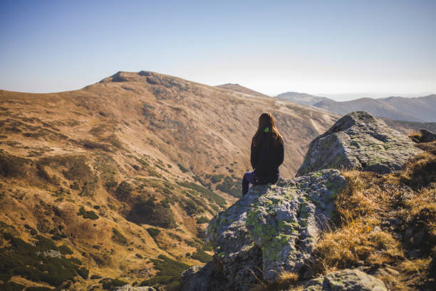 istock Girl Sitting on Rock 909168204