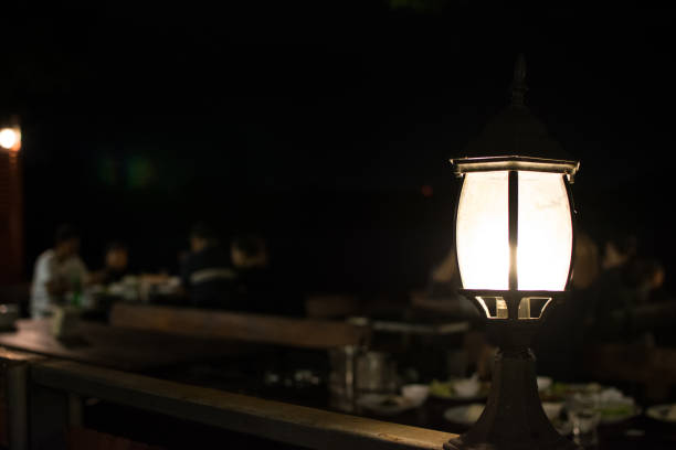 istock The lamp shines in the dark. 909168644