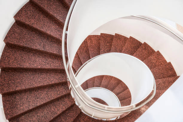 istock Spiral staircase with stone steps 909168760