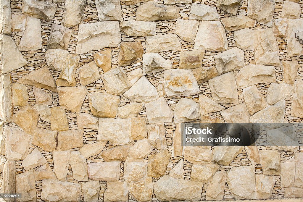 Beige stonewall - Foto stock royalty-free di Ambientazione esterna