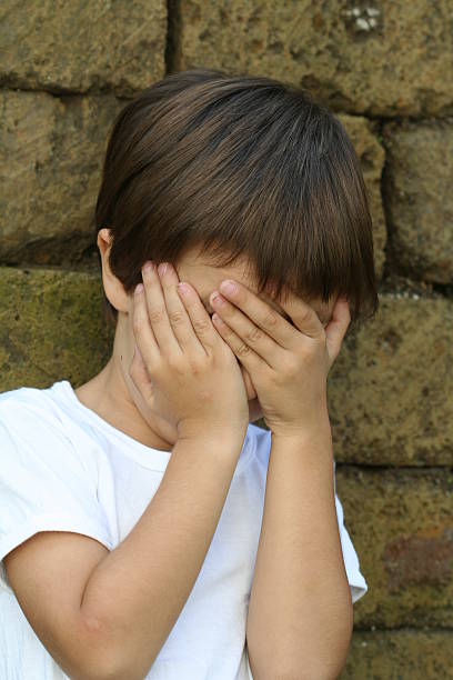 istock Child covering up his face 90917080