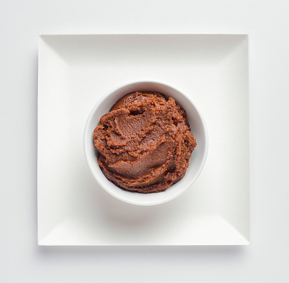 Miso paste in white bowl, overhead view