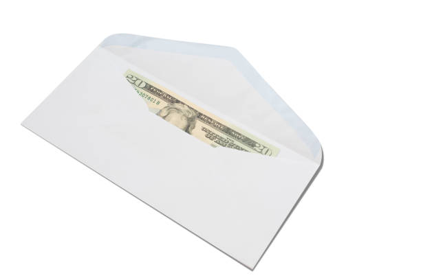 istock US Dollars in white envelope isolated on white background. 909175428