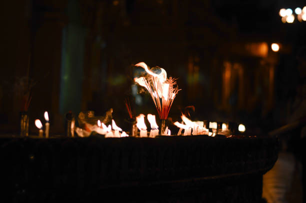 Burning incense sticks and light candles the darkness.