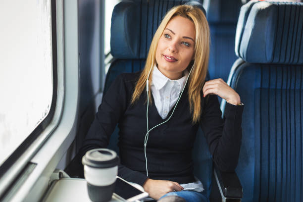 istock Happy girl traveling by train 909176042