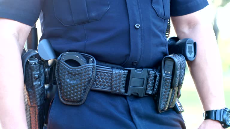 Cropped view of police officer duty belt