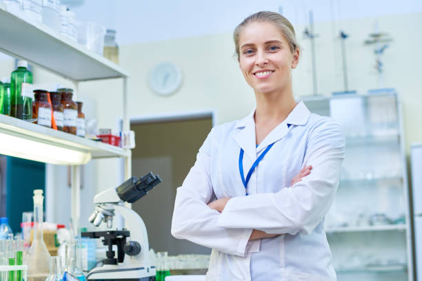 istock Cheerful Female Scientist in Lab 909176652