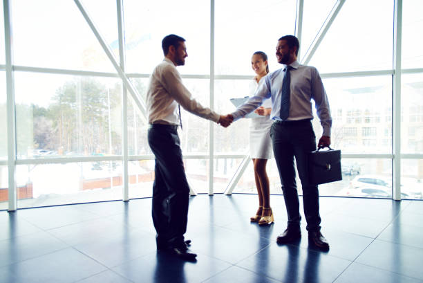 istock Successful business partners concluding deal 909180132