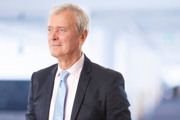 istock Thinking businessman standing in the office 909180702